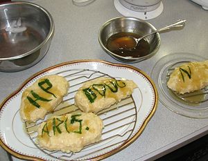 Applying the first coating of aspic to the chaud-froid and tarragon.