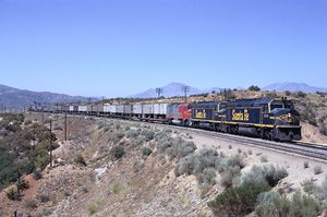 © Photo: Clark Bauman The Santa Fe Super C, powered by a pair of EMD F45s and an FP45 is seen at track speed east of the Cajon Pass Summit in 1971.